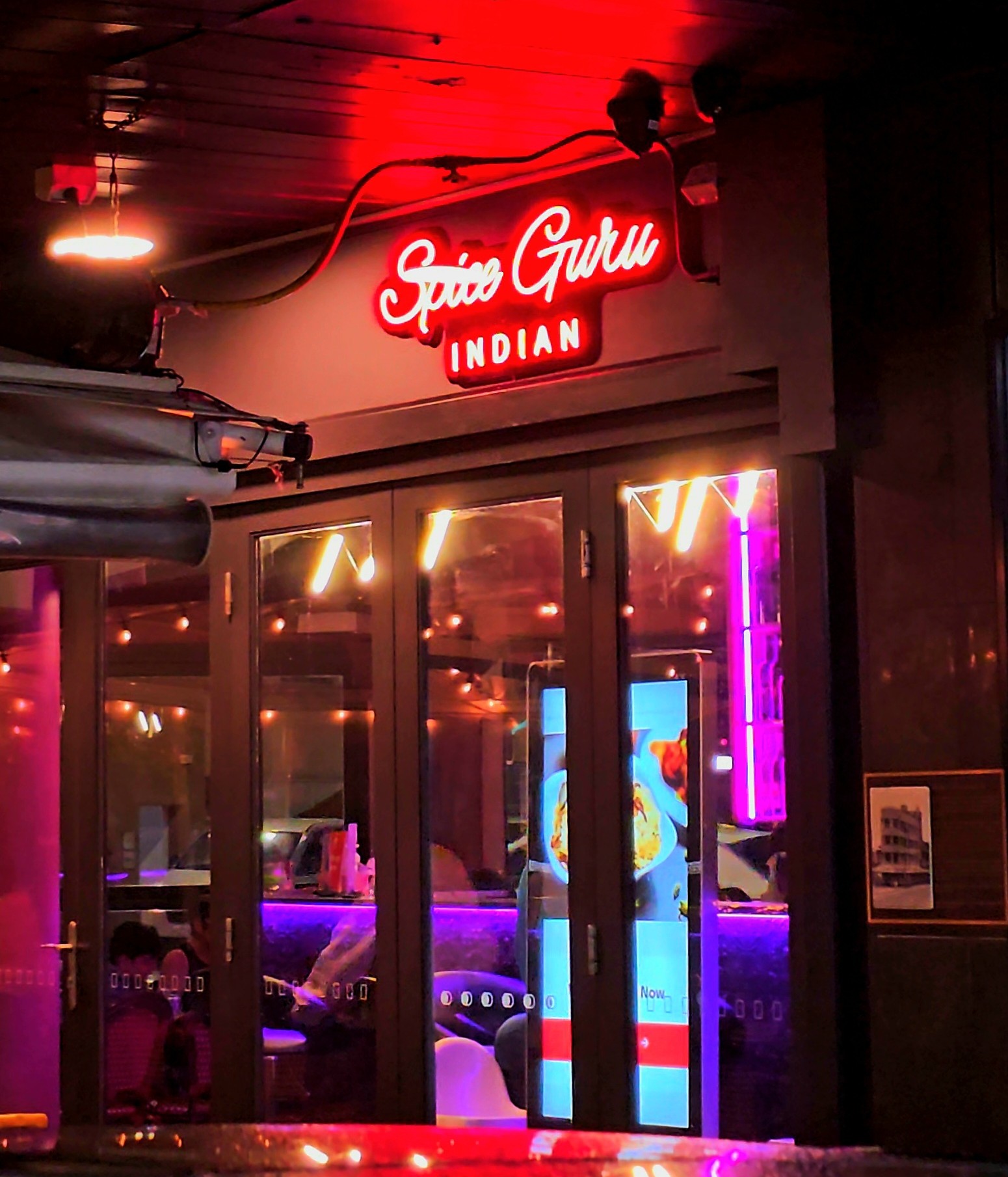 outside view of spice guru indian with the Spice Guru Indian text in red color cropped